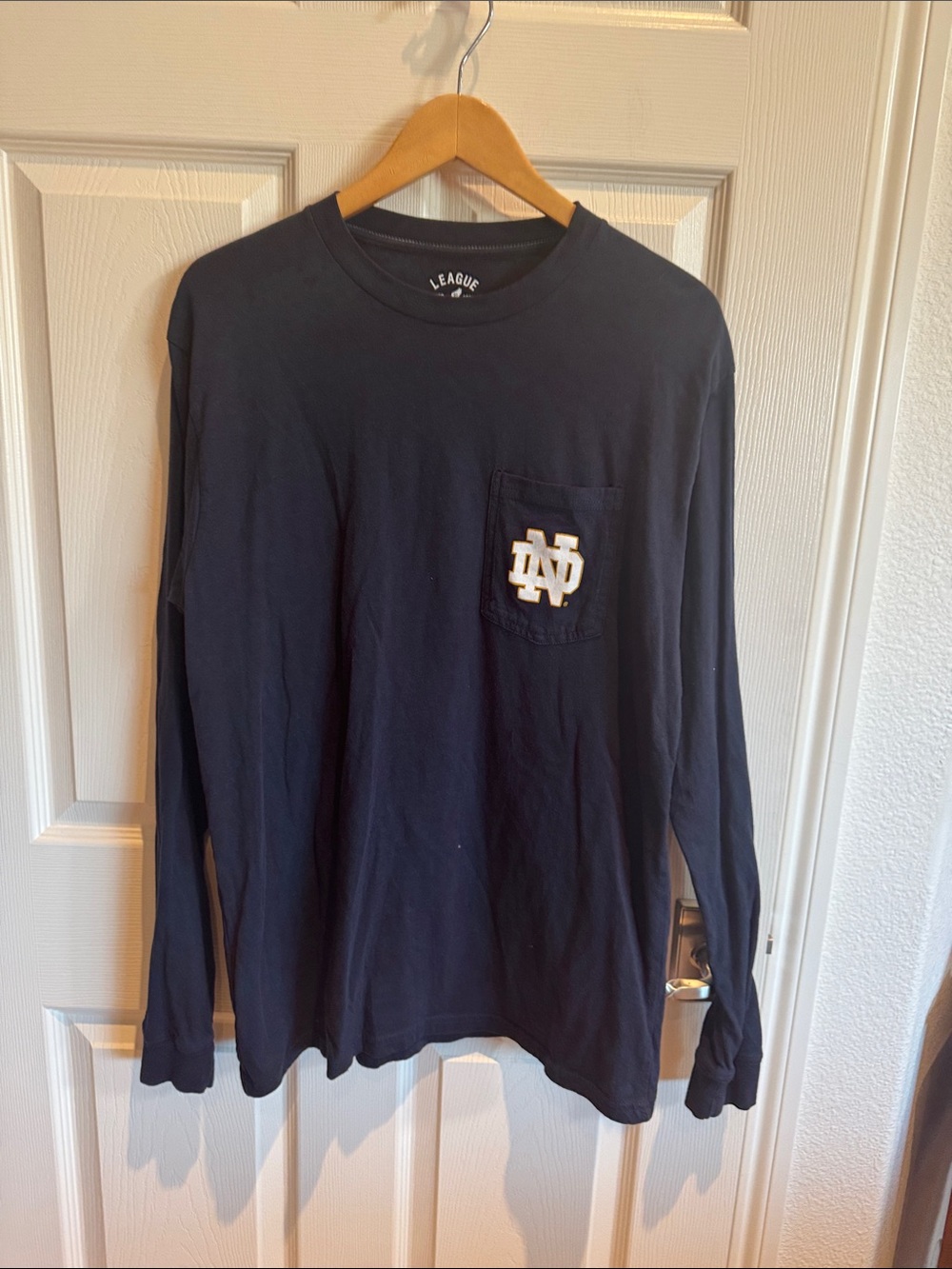 League Navy Long Sleeve Pocket Tee with White & Gold ND Logo